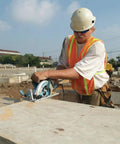 Worker using Lightweight Magnesium Hypoid Saw With Seven And One Quarter Inch Blade, 13.2 Lb Job Site Tough Power Tool, Oil Bath Tech