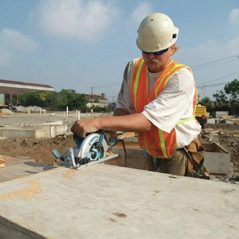 Worker using Lightweight Magnesium Hypoid Saw With Seven And One Quarter Inch Blade, 13.2 Lb Job Site Tough Power Tool, Oil Bath Tech
