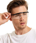Person wearing Five Pack Adjustable Safety Glasses For Work And Home Wide Vision Lightweight Fog Proof Protective Goggles Set