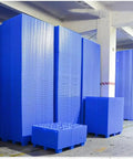 Stacks of blue Reusable Plastic Pallet System With Nestable Modular Trays And Grid Design For Wet Areas Like Kitchens And Garages.