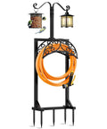 Outdoor Garden Hose Holder Stand With 5 Spikes And 2 Shepherd Hooks in black powder-coated steel, holding an orange hose