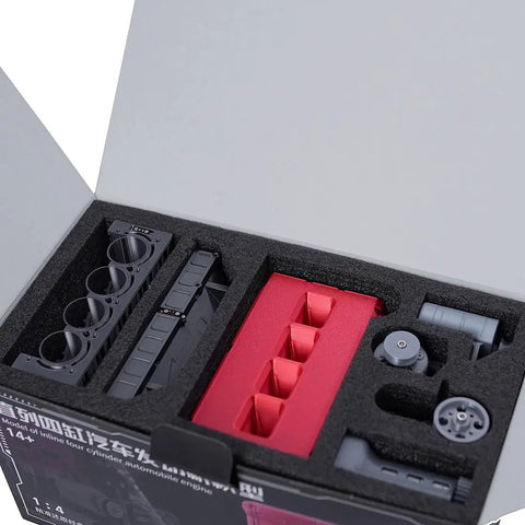 Close-up of L4 Inline Four Engine Model Kit That Runs Dope Mini Car Motor 3D Printed in packaging, 150-plus parts.