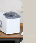 Compact Countertop Ice Maker Crafting Quick Bullet Ice In Six Minutes Flat on wooden counter, perfect for kitchen bars or casual hangouts.