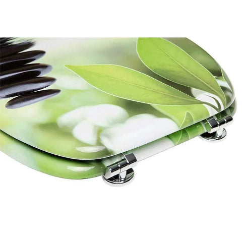 Prime Soft Close Toilet Seat With Adjustable Quick Release Hinges And Dead Quiet Slow Shut Action For A Durable Resin Bathroom Setup, top view with leafy design and silver hinges.