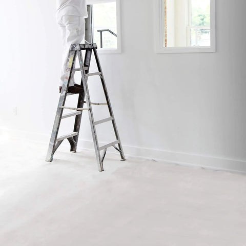 Heavy Duty 12 Ounce Canvas Drop Cloth 9 By 12 Feet For Paint Protection covering a floor during painting project with a ladder.