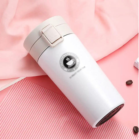 Dope 380 Ml Double Wall Stainless Steel Coffee Mug With Solid Lock Leak Proof Push Button Lid and Built In Mesh Filter on pink background.
