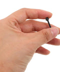 Hand holding a Black M2.5x18.5mm Tuner Peg Screw showcasing its design for classical guitar machine heads.