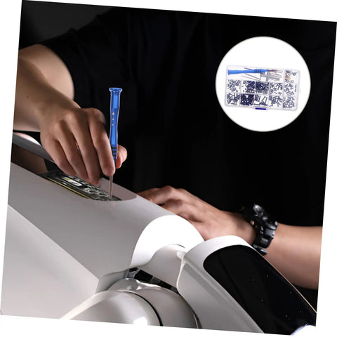 Person using RC Car Repair Tool Kit With Wrench, Screw And Fastener Set on white RC model, overview of tools shown.