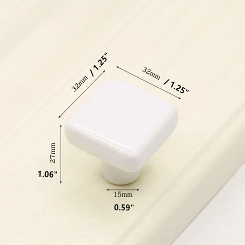 1.25 Inch Glossy Ceramic Square Cabinet Knob White, measurements shown on beige background