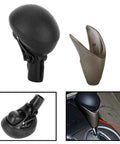 Upgrade Your Ride With This Sleek Tertioi Gear Shift Knob And Lever For Smooth Manual Or Auto Transmissions. Features Anti Skid Grip, Easy Install Kit, And Wrap Tape For A Custom Look That Keeps Your Drive Cool And Comfortable While You Cruise The. black ABS rubber gear shift knob with cover, installed on car console