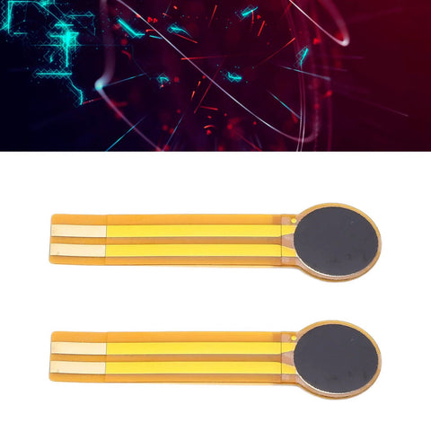 Two FLEXMAN thin-film pressure sensors with circular black pads on orange flexible substrate, 20g–3kg range.