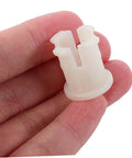 Twenty Durable Plastic Caster Socket Sleeves Fit Tight Inside Chair Feet To Crush Those Pesky Wobbles And Keep Your Furniture Rolling Smooth Around The Neighborhood, beige plastic sleeve held in hand.