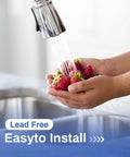 Hands washing strawberries under a lead-free kitchen faucet with easy-to-install feature
