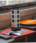 Heavy Duty Usb Power Strip With Secure Outlet Protectors Multi Port Smart Charger Fireproof Build For Phones Tablets Heavy Load Built Tough Quick Charge Hub on a desk next to a phone and vinyl records.