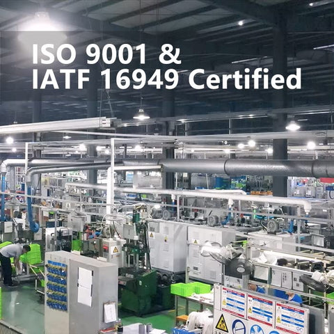 Industrial manufacturing facility with ISO 9001 and IATF 16949 certification signage displayed, showcasing machinery and operations.
