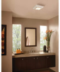 Modern bathroom with Bluetooth Speaker Bath Exhaust Grille Cover With LED Light For Bathroom Fans White Finish installed on ceiling.