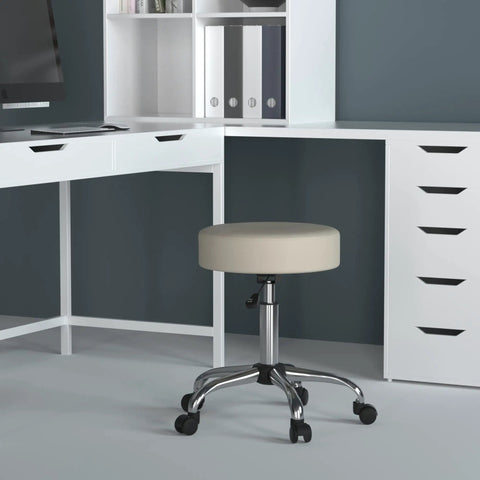 Ergonomic Adjustable Height Stool For Beauty Salons And Medical Spa With Plush Beige Cushioning Heavy Duty Chrome Swivel Base And Smooth Gas Lift in office setting.