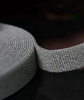 Heavy Duty Reusable Cable Management Straps White Tearable Cord Organizer Tie For Computer Speaker Guitar Wires close-up of nylon strap