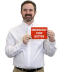 Man holding an Emergency Stop Button Label With Reflective Laminated Vinyl, 7 By 5 Inches, showing durable outdoor signage.
