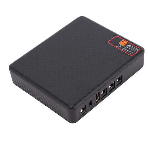 Compact Mini Ups Backup Battery Delivers Rock Solid Power To Your Modem And Router Keeping The Feed Alive When The Grid Drops. Black portable power supply with USB ports.