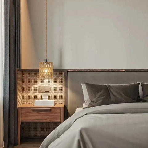Straight Up Chic Boho Woven Rattan Plug In Pendant Ceiling Light casting warm geometric shadows in a cozy bedroom.
