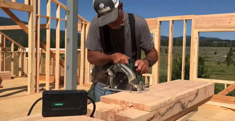 Construction site with worker using a saw connected to All Day Runtime MultiVolt AC Adapter For 36V Tools, Your Power Source On The Go With A 20 Ft Pivoting Cord, Generator And Long Extension Cord Ready, ET36A.
