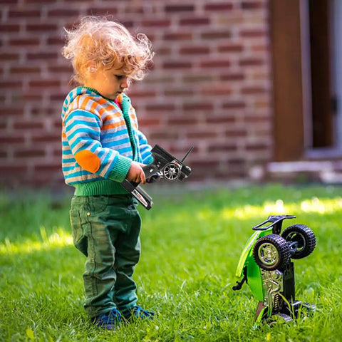 Child using GT3B 2.4Ghz 3 Channel RC Transmitter With GR3E Receiver For Cars And Boats LCD Screen AFHDS Remote outdoors