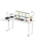 Sweeping L Shaped Standing Desk With Sturdy Four Leg Frame For Epic Gaming Or Pro Workstations with dual monitors and printer.
