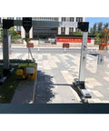 Real Deal Portable Gantry Crane With Electric Winch And Chain Ratchet, aluminum frame and electric winch on outdoor pavement.