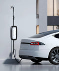 No Sweat NEMA 5 15P To 6 20R EV Charging Adapter 12 Inch UL Listed Cord connected to a white electric vehicle.