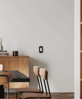Room with Meadows Light Switch Cover Plate In Greek Revival Style on wall next to wooden furniture and modern decor.