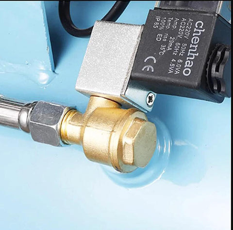 Installed view: brass three-port check valve with male threads (G1/8, G3/8, G1/2) mounted on a blue air compressor housing.