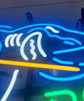 Close-up of a Hand Crafted Glass Tube Neon Sign For Beer Bar, 17 Inch Wide By 13 Inch High, showing blue and white neon shark design.