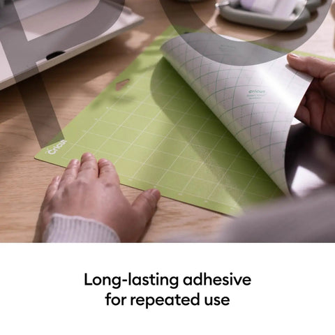 Person peeling back green mat showing Cutting Mat Variety Pack Four 12 By 24 Inch Mats For Crafting Workhorse Set With Light Grip