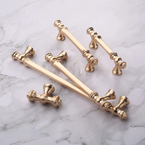 Six Pack Brushed Brass Cabinet Pulls 7.5 Inch Center To Center Hardware Gold Kitchen Cabinet Handles on marble surface
