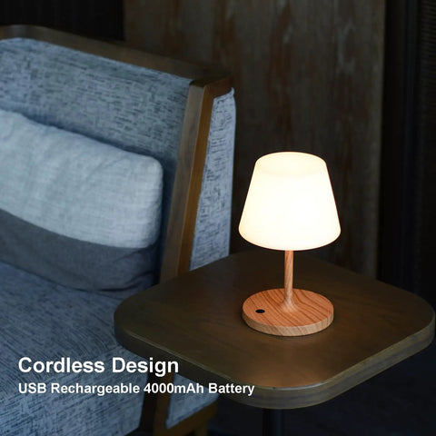Cordless USB Rechargeable Table Lamp With 4000mAh Battery, 2700K Warm LED, on a wooden table beside a sofa