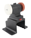Cordless Mini Bench Grinder Compatible With 18V Battery Power and a solid black workbase with white and brown wheels.