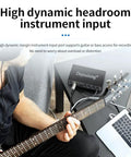Person using guitar with Plug And Play USB Audio Interface For Home Studio With Two Mic Preamps, 48V Phantom Power.