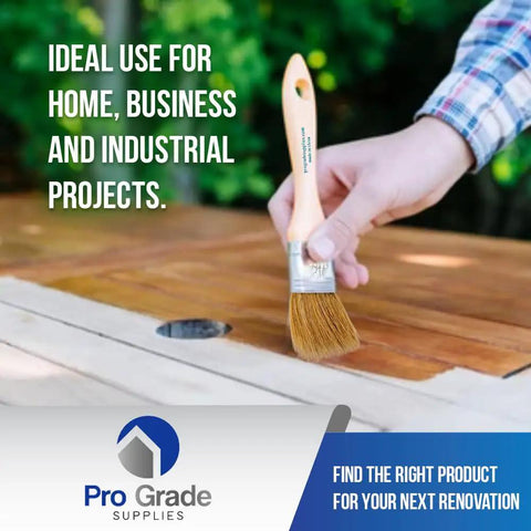 Person using 96 Pack 1.5 Inch Chip Paint Brushes For Painting And Staining, Solid Wood Handles on wooden deck.
