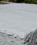 Close-up of Brushable Chimney Crown Repair Elastomeric Waterproof Coating For Crowns And Masonry, Fast Setting No Fuss Protection 1 Gallon applied.