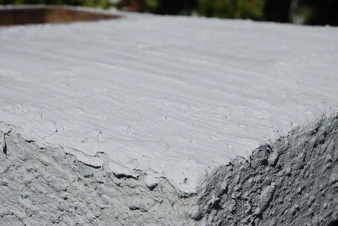 Close-up of Brushable Chimney Crown Repair Elastomeric Waterproof Coating For Crowns And Masonry, Fast Setting No Fuss Protection 1 Gallon applied.