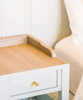 Round Ball Cabinet Knobs For Dresser And Kitchen, Brushed Brass 0.95 Inch Diameter, installed on a white nightstand drawer.
