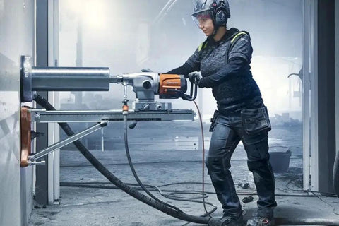 Straight Up Kickass Core Drill And Stand With 4.29 Hp Motor three speed gears being used by a person drilling concrete wall.