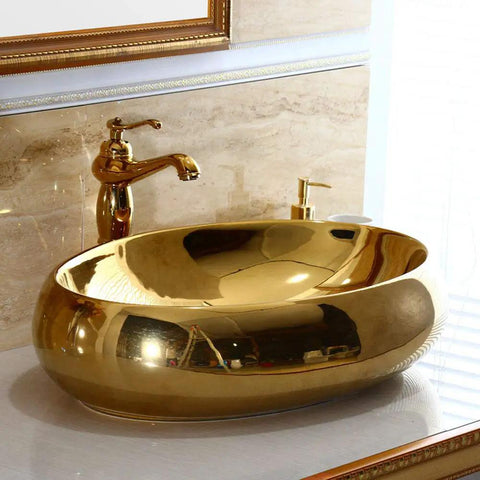 Heavy Duty Ceramic Vessel Sink For Modern Bathrooms With Included Faucet Dope Gold Oval Basin on bathroom counter.