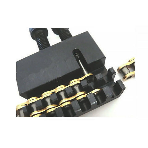 Close-up of Go Kart Chain Breaker Tool 219 Deluxe Chain Cutter for Kart Racing with Chromoly Pin cutting a chain link.