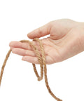 Hand holding 100 Feet Thick Twisted Nautical Rope For Crafts And Gift Wrapping Brown Jute String Twine Decorative Rope