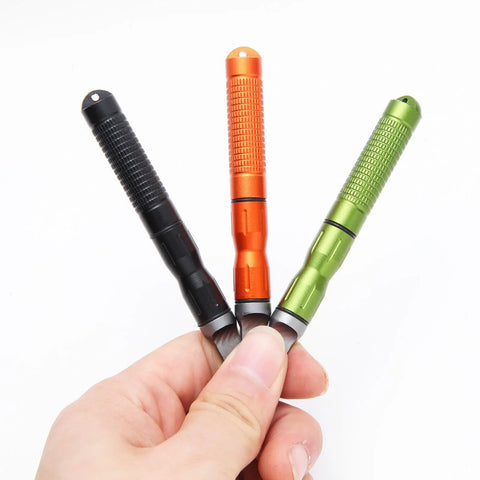 Hand holding three colored rods from Six Pack Ferro Rod Fire Starter Kit With Striker Flint And Steel Fire Sticks Magnesium Rod