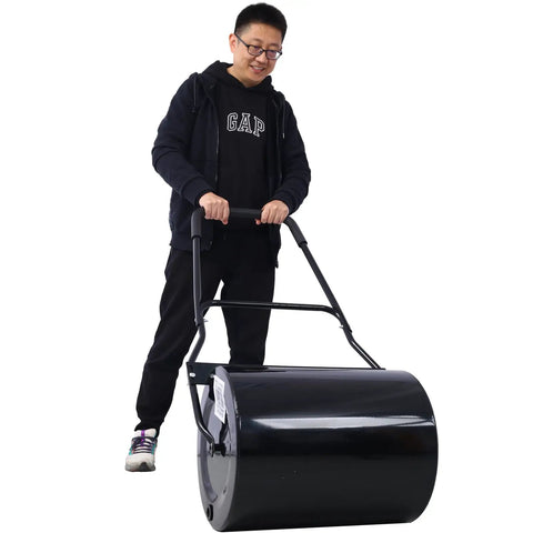 Beefy Pro Grade Lawn Roller For Smooth Lawns Push Or Tow Design with 48.5 Inch Height 16 Gallon Drum in use by man, black steel.