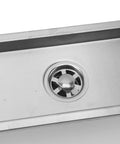 Close-up of the Oreilet Linear Shower Drain 12 Inch Floor Drain with Hair Catcher featuring a stainless steel grate and drain hole.