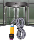 JYIO 10 Pack Infrared Photoelectric Switch Diffuse Reflection Sensor in front of automated door, featuring rugged 1.1m cable